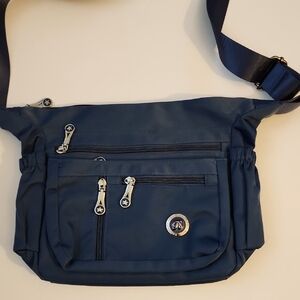 Fabuxry Blue Crossbody Bag. 4 Front Zippers And 1 In The Back.